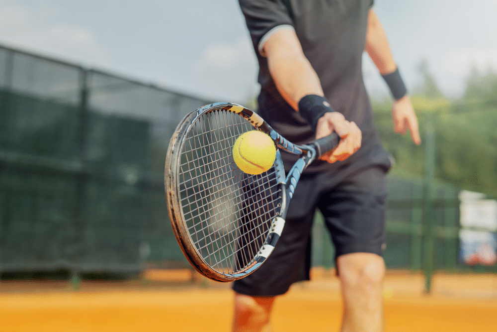 A view of a guy serving in tennis