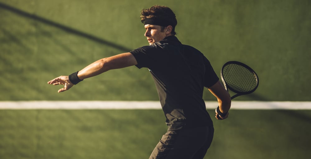 Professional Tennis Player About To Hit A Forehand During A tennis game 