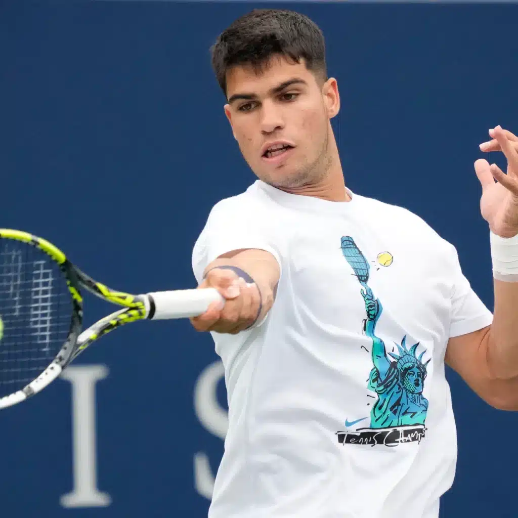 A view of a person holding a tennis using a pull wrist shot