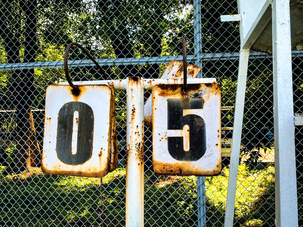 A view of tennis scores on a barbed wire