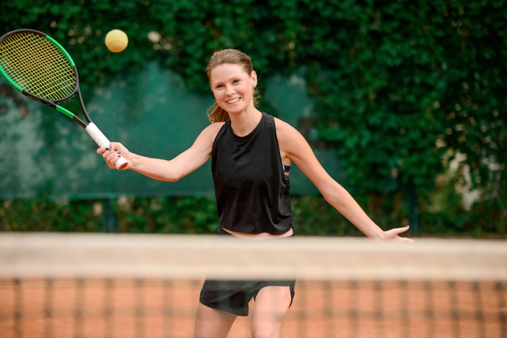 Female Player Playing The Forehand Tennis Shot