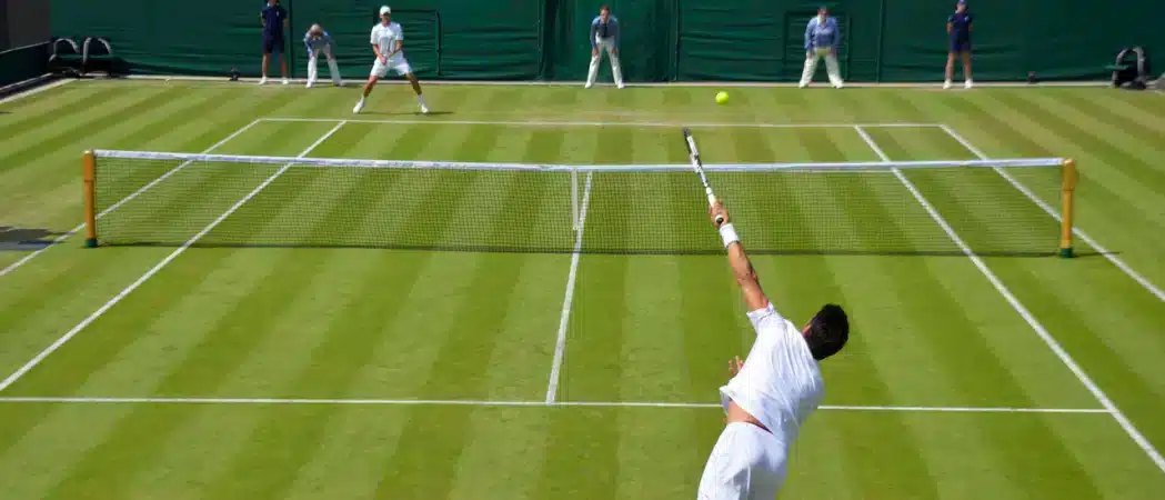 a player hitting an ace in tennis court