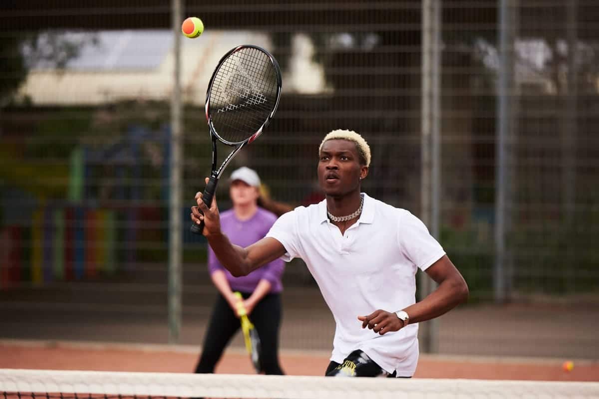 a player playing a shot blurred shot of a woman behind