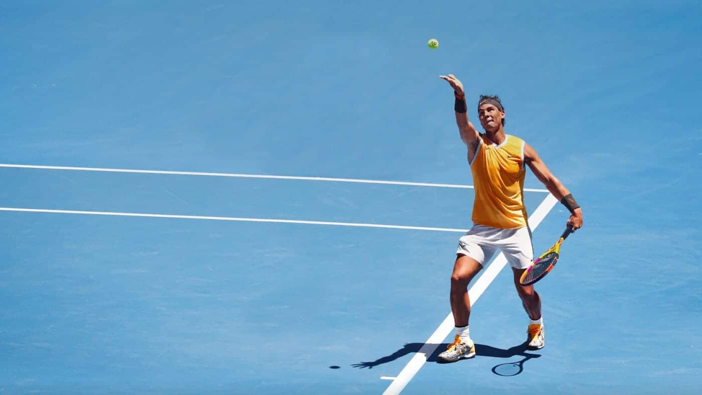 player serving tennis on court