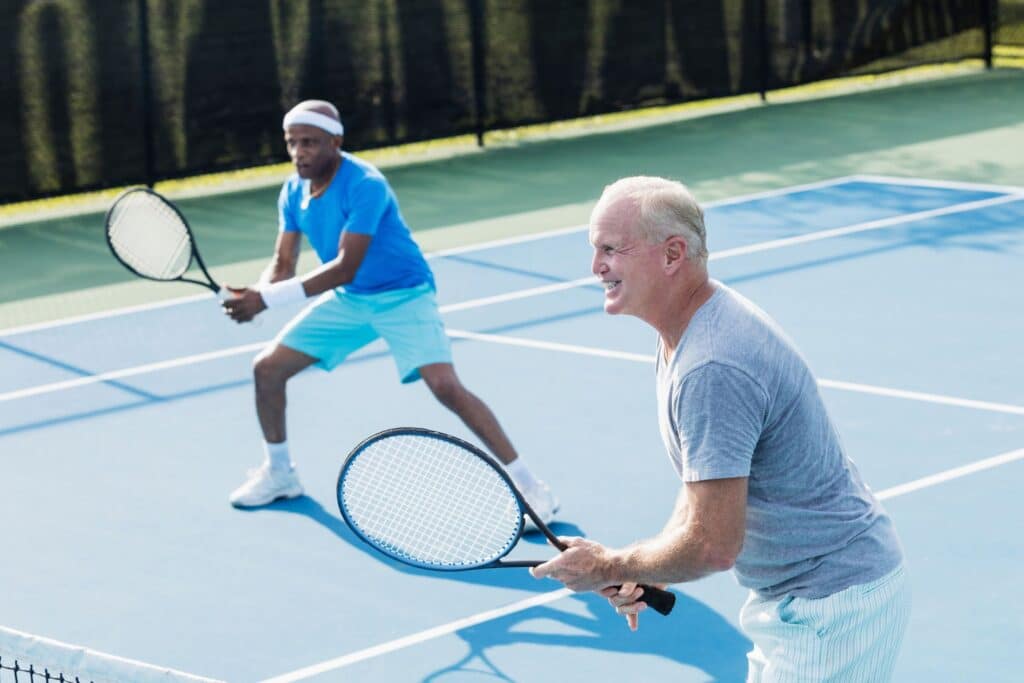 tennis players playing with a racket