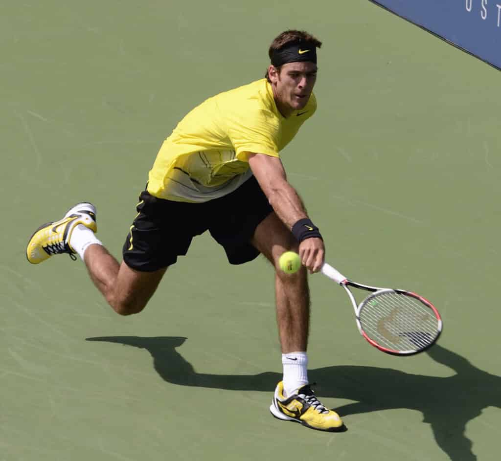 young player in hitting lob tennis shot